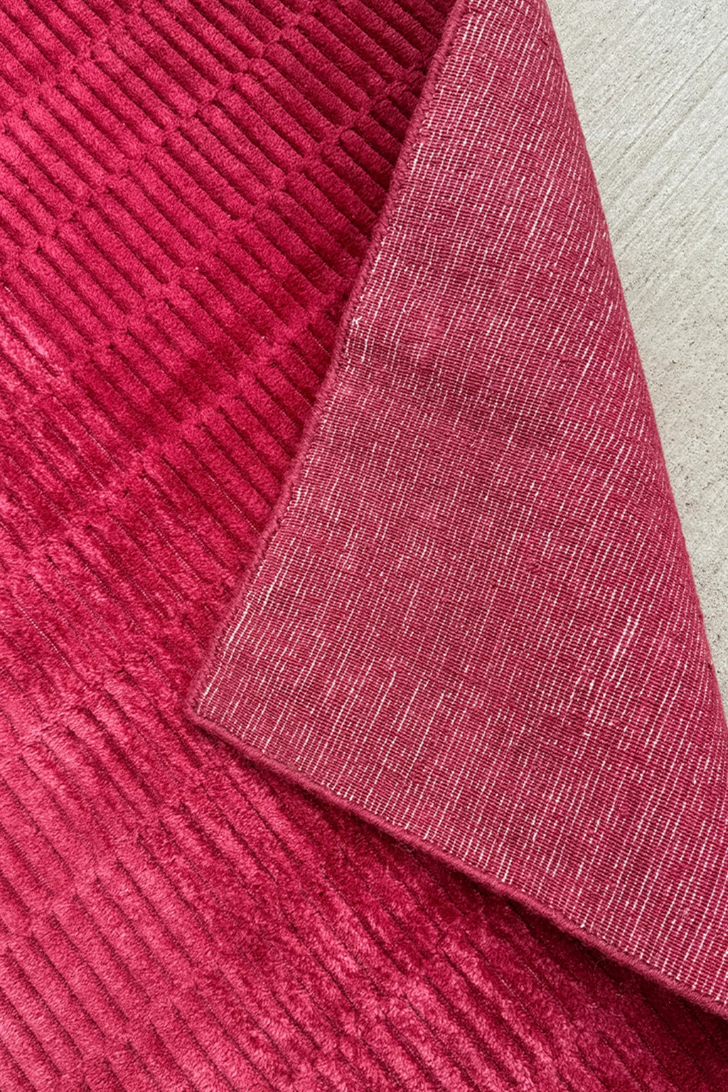 close up view of hot pink runner rug handmade in wool