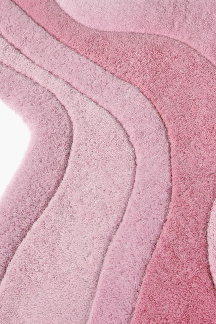 Modern hand-tufted pink wool rug with scalloped edge and rolling contour lines rose