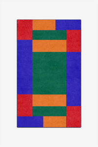 Colorful geometric patterned rug on a white background