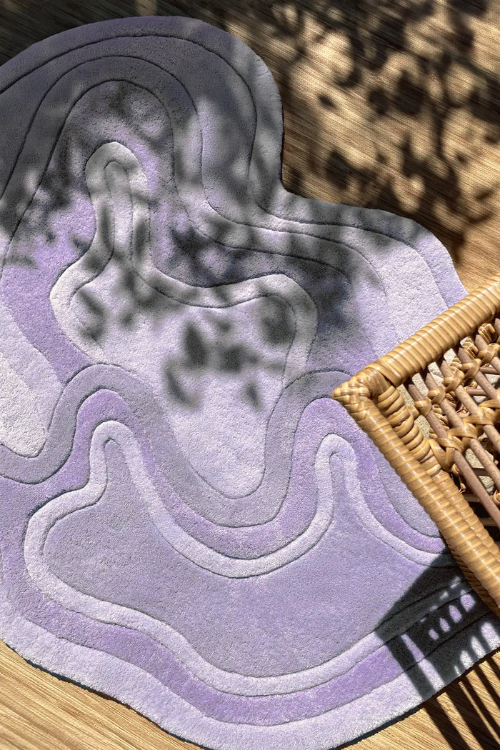 Sculptural purple abstract wool rug with organic modern shape for boho interiors lavender