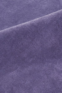 close up of the soft cut pile on a purple cornflower hand-tufted wool rug