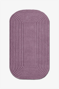 purple wool area rug with textured striped detail and rounded corners