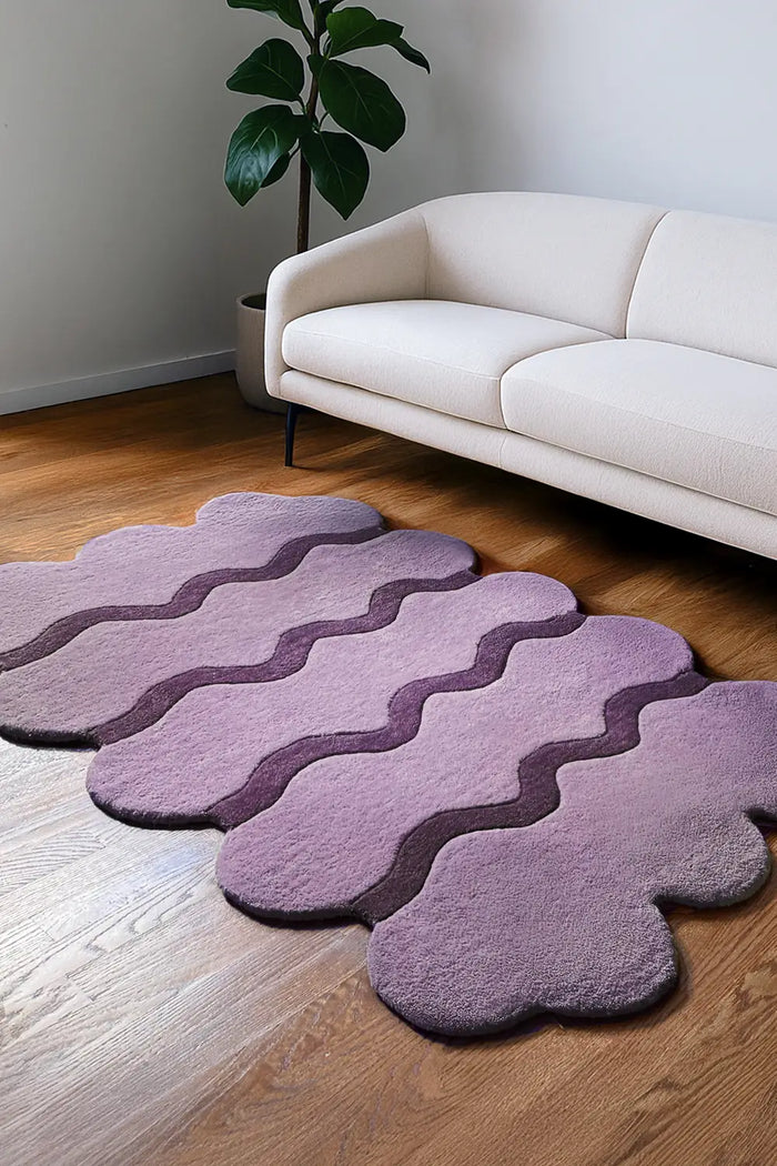 Boho purple wool ripple rug styled in bright living room, custom colorful rug lifestyle