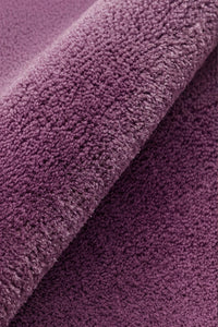 Close-up of purple textured wool rug