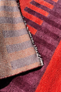 red and purple striped square rug texture