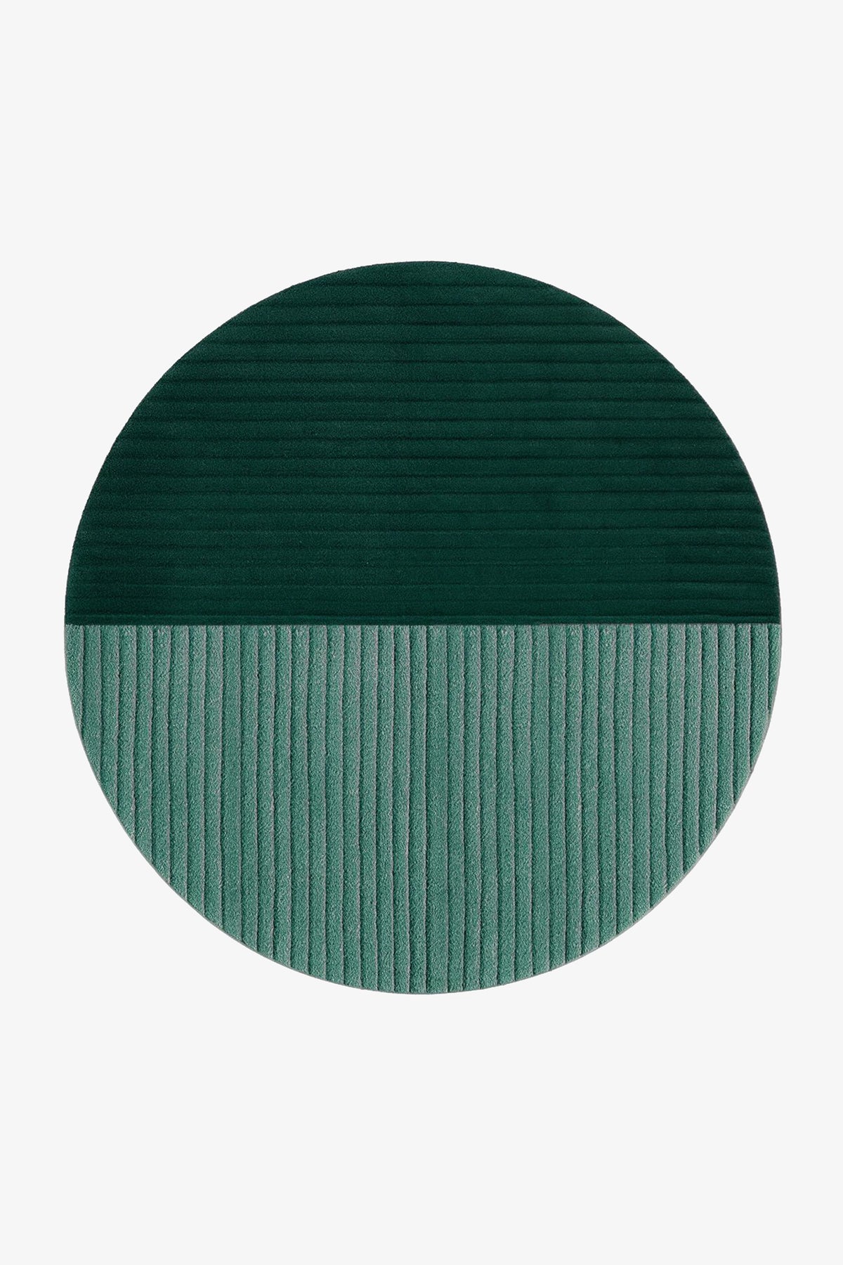 A round area rug with a split design, featuring a dark forest green top half with horizontal ribbing and a muted teal-green bottom half with vertical ribbing, shown on a plain white background.