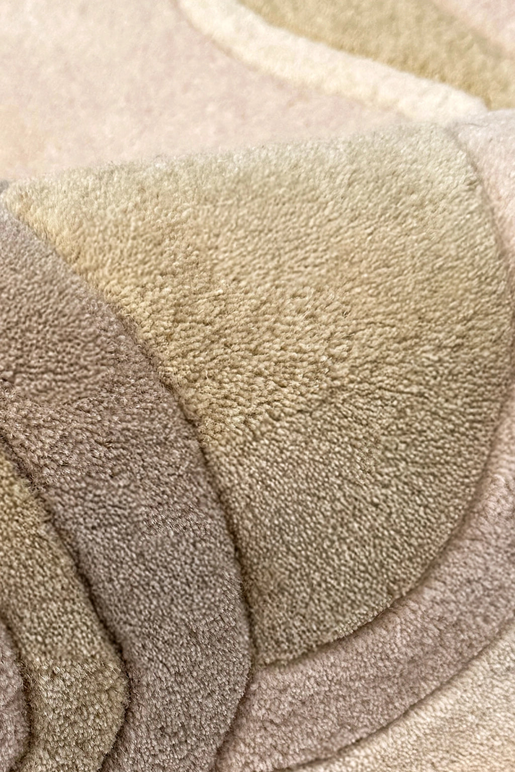 Close-up of beige and brown textured wool rug