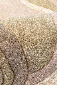 Close-up of beige and brown textured wool rug