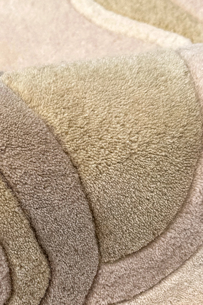 Close-up of beige and brown textured wool rug