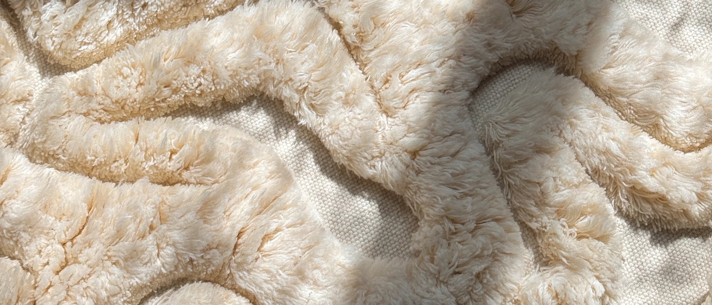 Rolling Tides rug, carved contour lines across an organic form