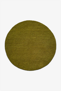 Round dark olive green wool rug on a white background