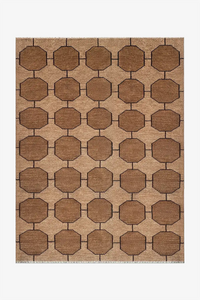 taupe rug with brown geometric pattern on a white background with mid century modern style