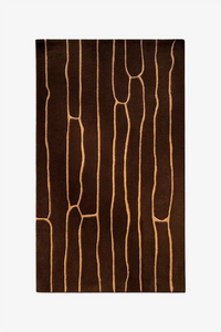 Brown wool rug with abstract beige patterns on a white background