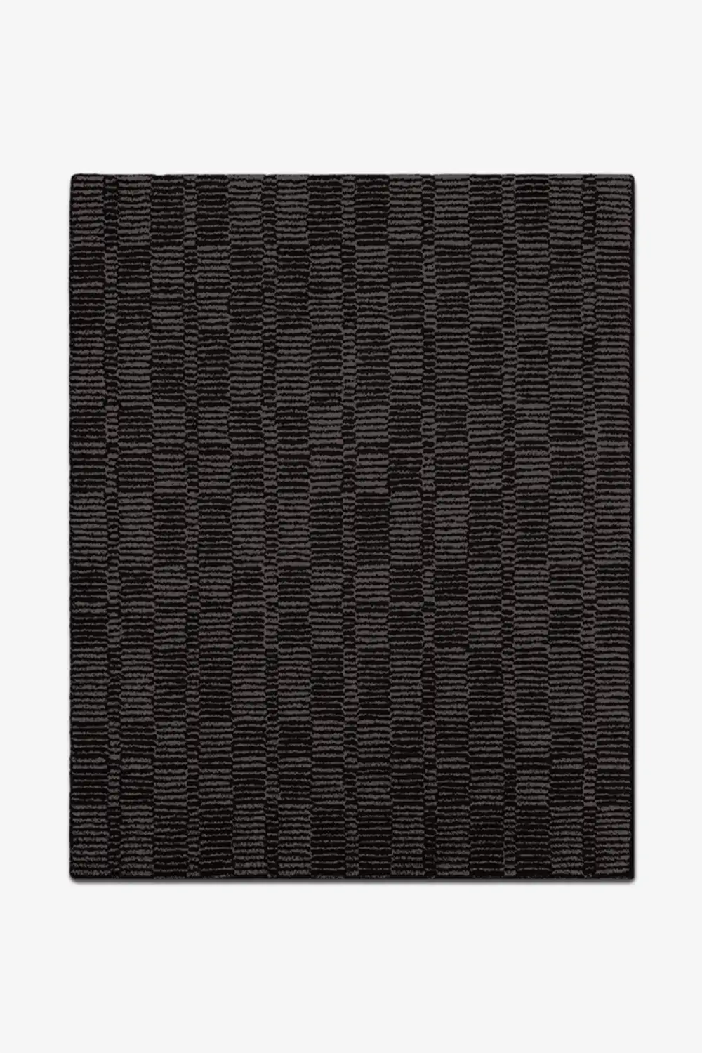 Black geometric patterned rug on a white background