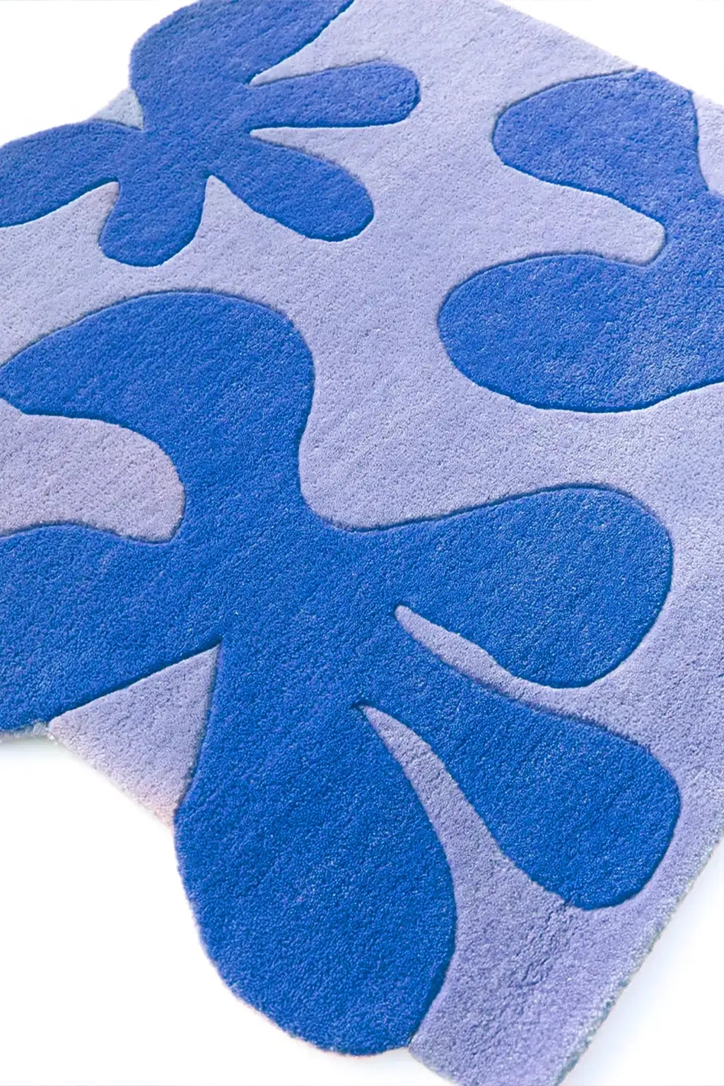 Close-up of a blue and gray patterned floral rug