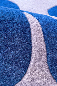Close-up of a blue and gray textured rug