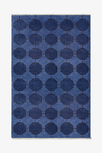 Blue geometric patterned rug in hand-knotted wool on a white background | 5x8