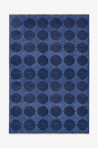 Blue geometric patterned rug on a white background hand-knotted wool | 6x9