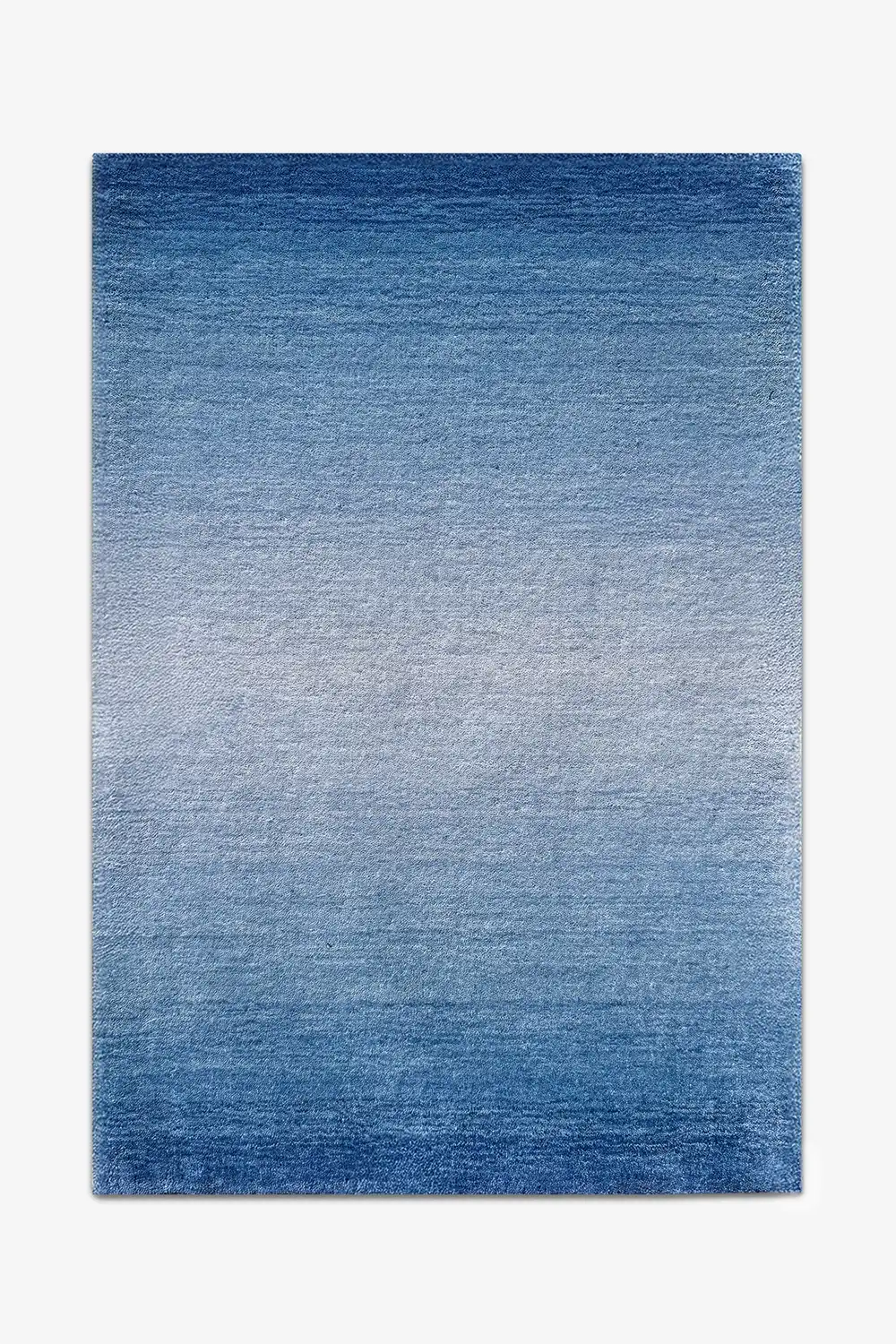 Blue ombre wool rug on a white background