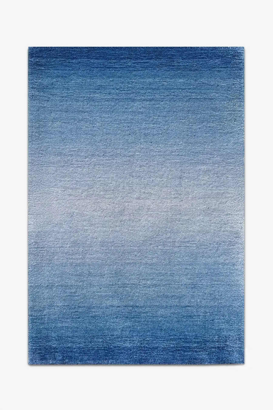 Blue ombre wool rug on a white background