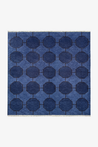 Blue square rug with a geometric patterned rug on a white background | 5x5