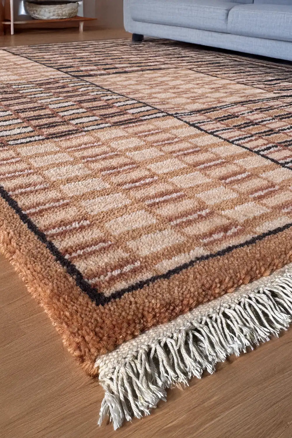 Large 9x12 brown and tan checkered rug in bright living room, mid century modern wool area rug for neutral interiors