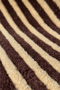 Brown and tan 8x10 striped wool rug with textured tufted surface for cozy modern interiors