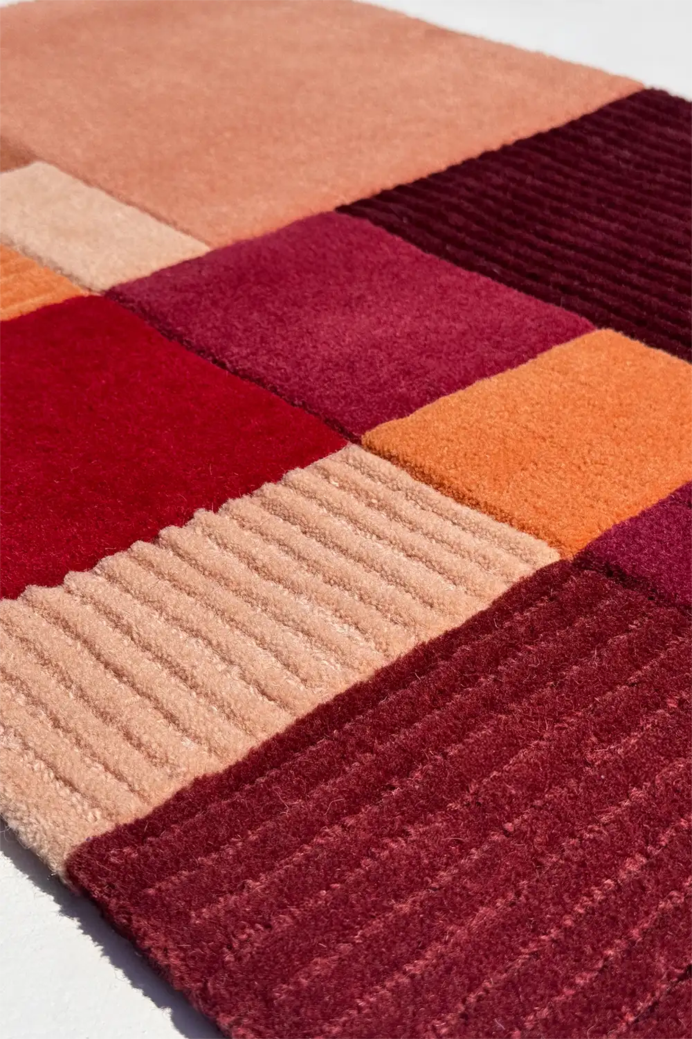 Colorful patchwork rug with geometric pattern