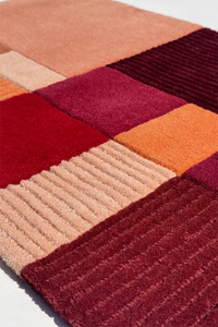 Colorful patchwork rug with geometric pattern