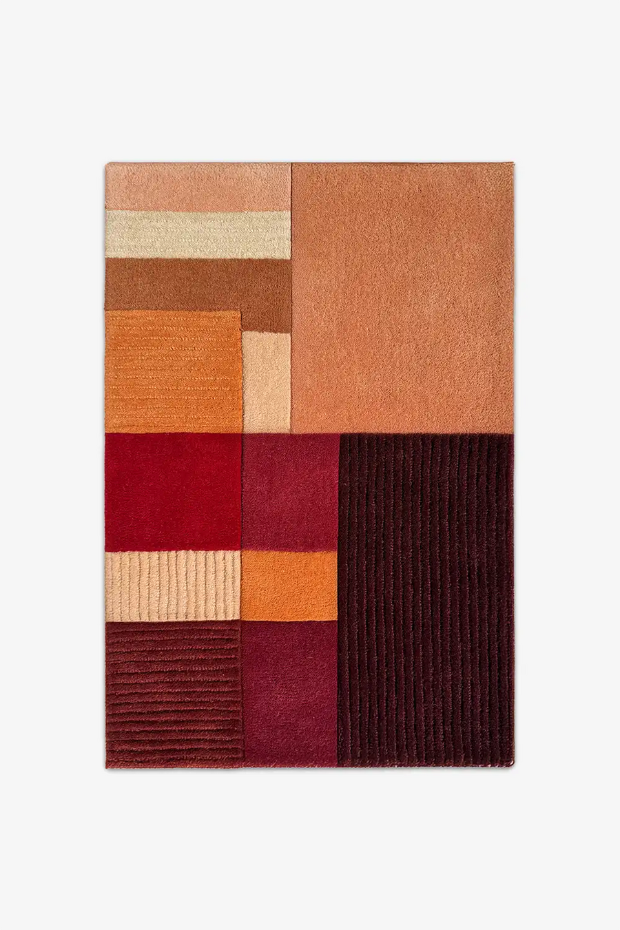 2x3 multicolored geometric rug with a patchwork design on a white background
