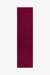 burgundy pink runner rug on a white background
