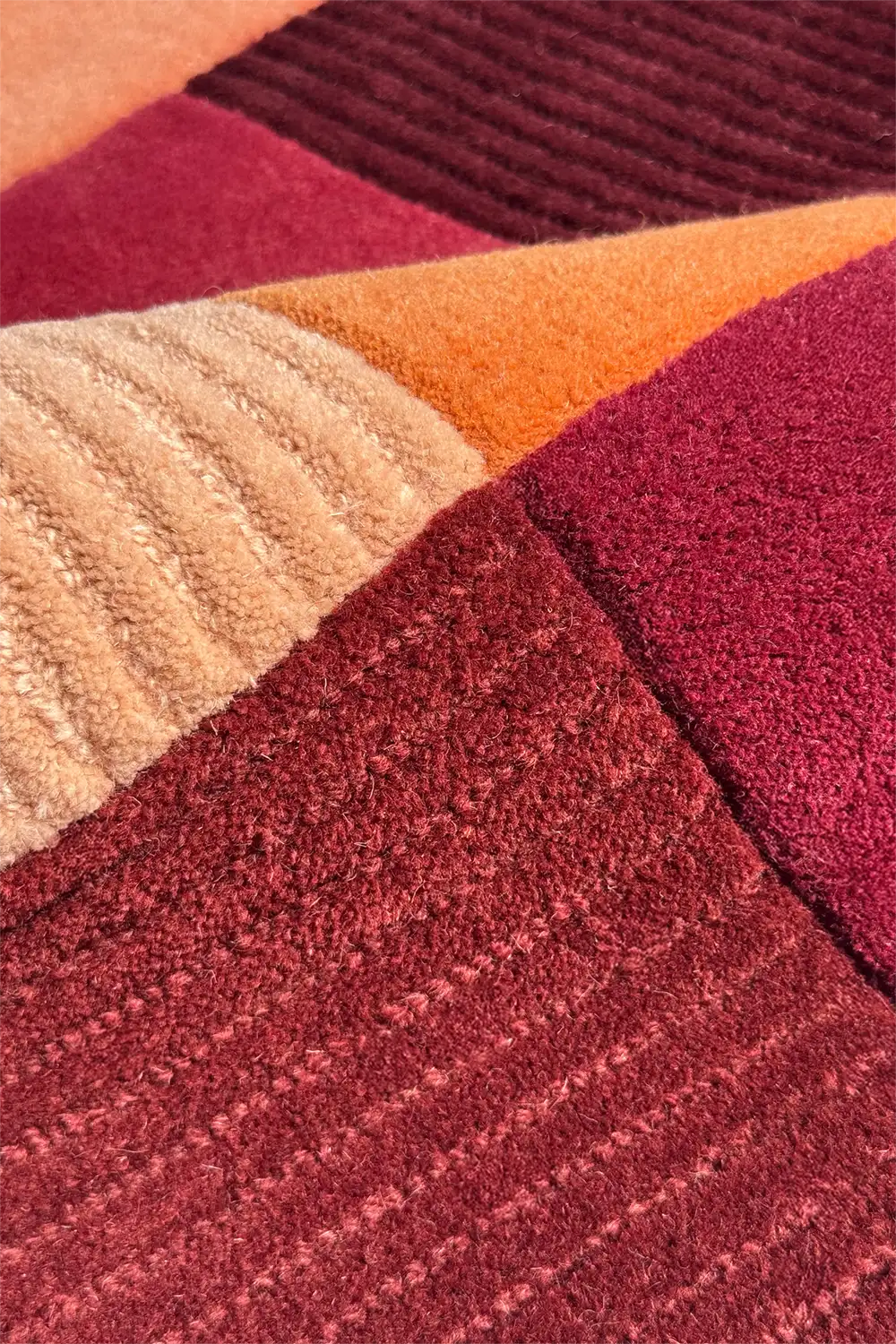 Close-up of a textured wool rug with multicolored pattern