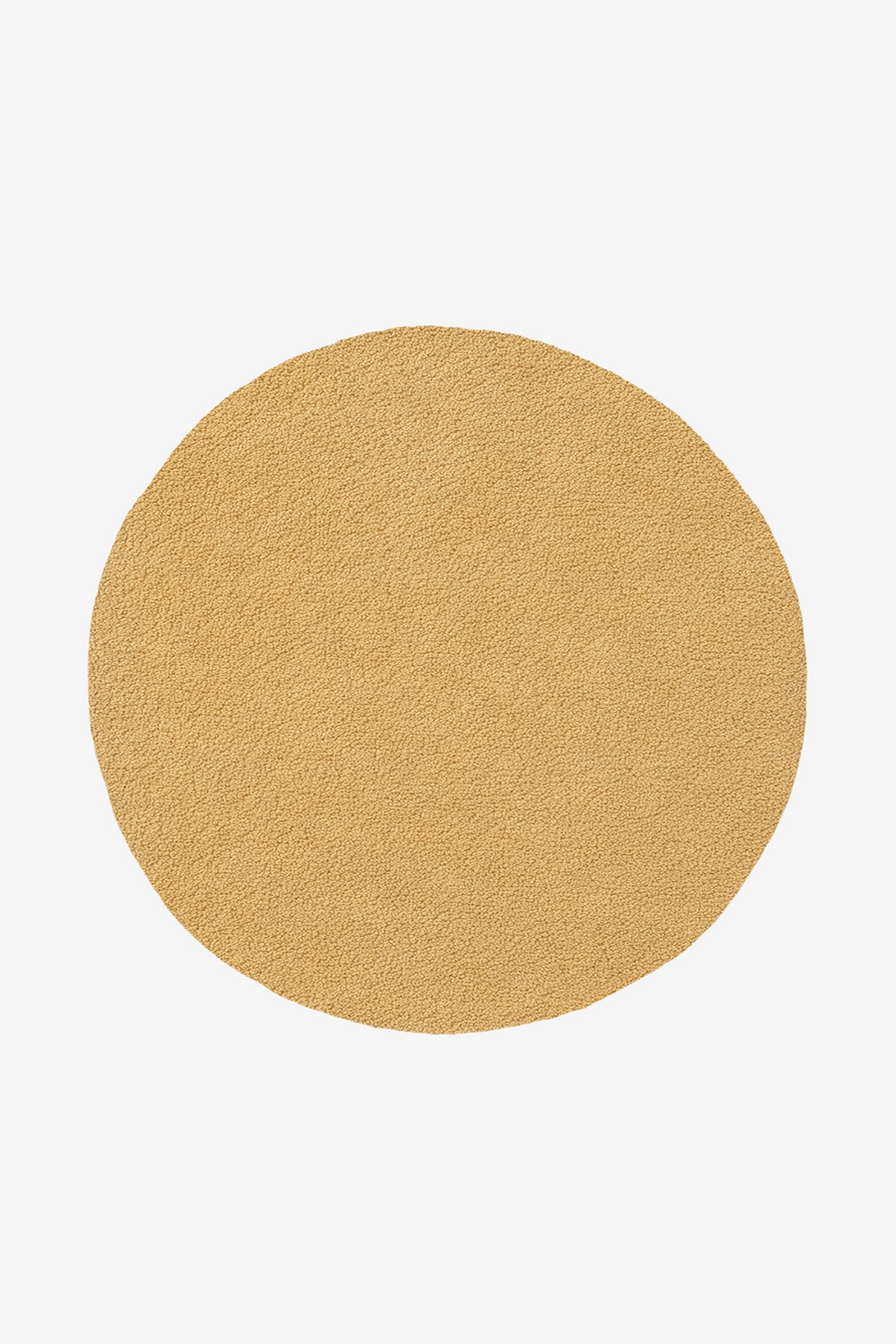 yellow round wool rug with soft buttery surface hand-tufted in natural materials