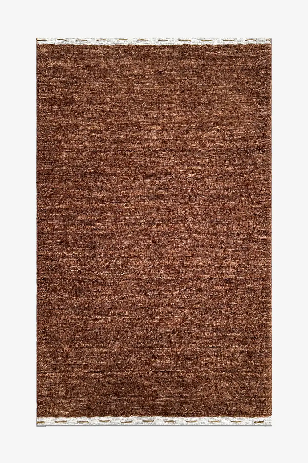 medium brown wool textured rug on a white background