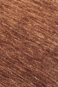 Close-up of brown textured wool area rug modern chestnut
