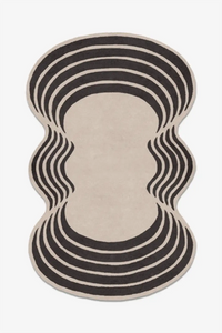Decorative rug with black wavy pattern on a beige background