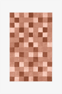 Terracotta and orange checkered wool rug with warm earthy tones