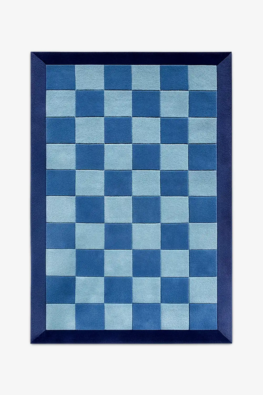 Blue checkered rug with a navy border in wool on a white background