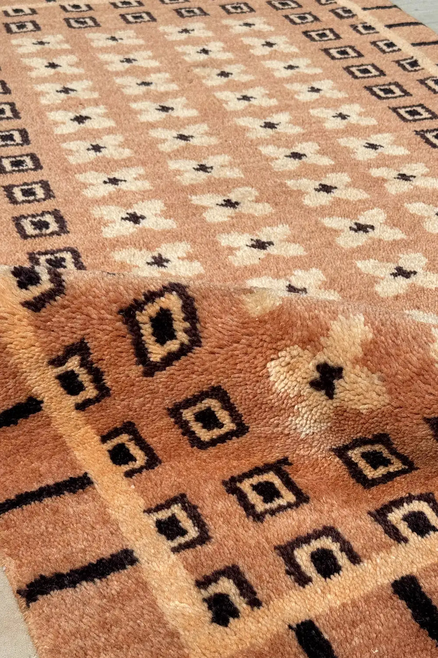 Modern geometric wool rug with small square motifs, hand knotted in tan and black, perfect for Japandi or MCM homes