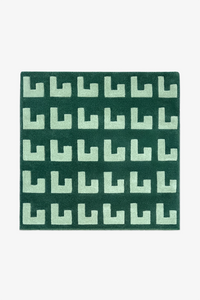 square green patterned rug on a white background