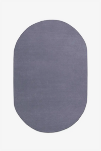 modern oval-shaped dusty blue gray rug on a white background