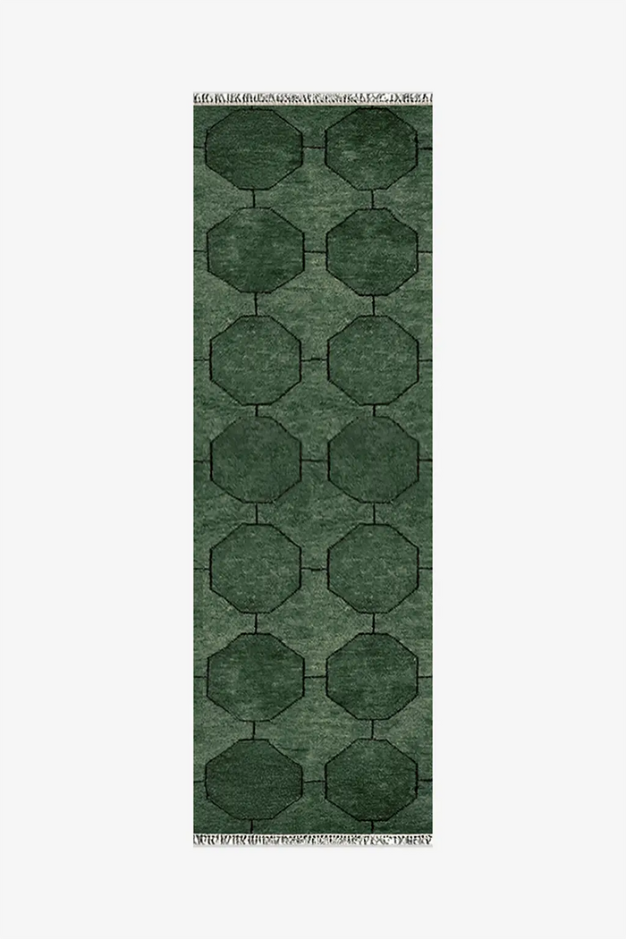 Green geometric patterned runner rug on a white background | 2x7