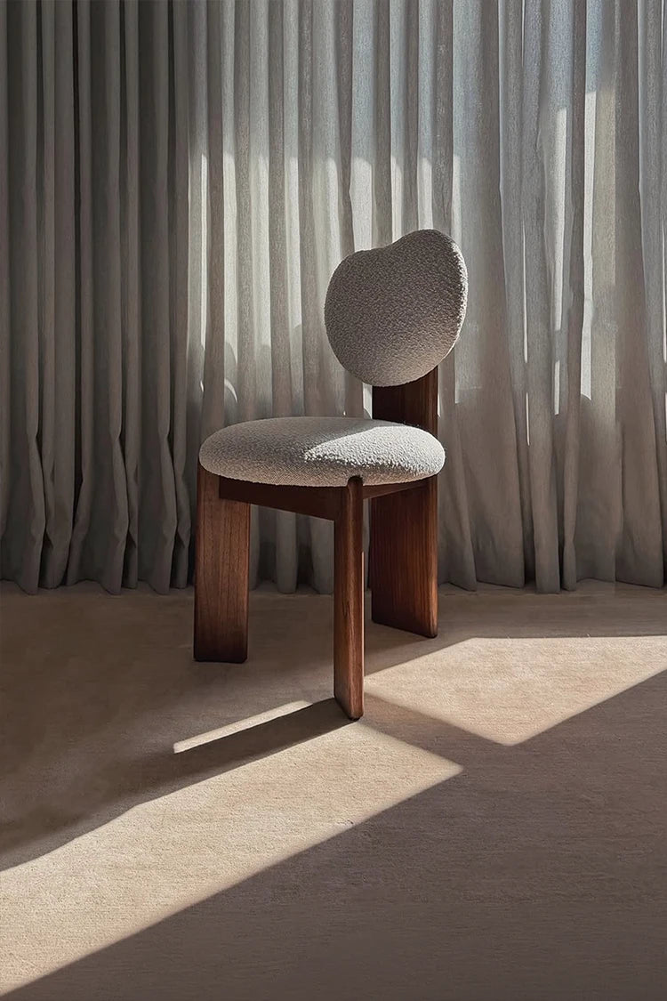Modern chair with wooden frame on a neutral wool rug