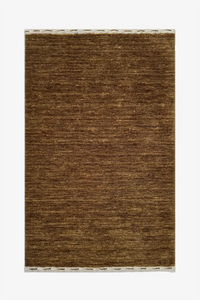 taupe golden brown textured rug on a white background hazel