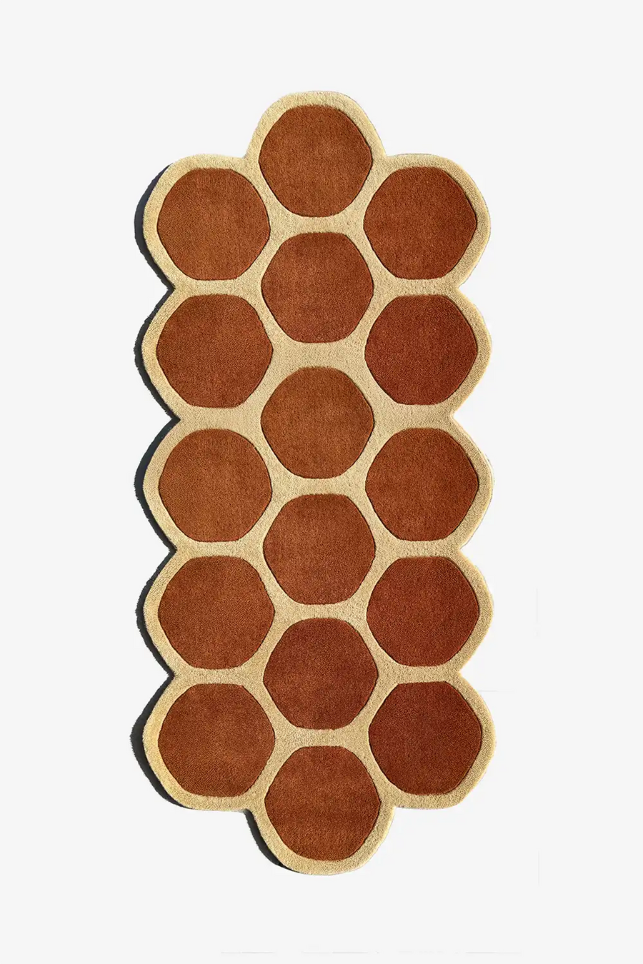 modern wool runner rug with hexagonal pattern in brown and tan on a white background