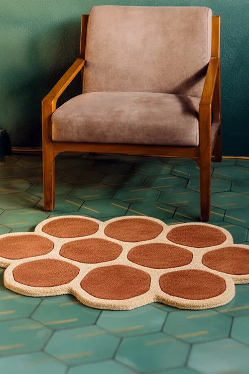 unique geometric accent rug in a green tiled room
