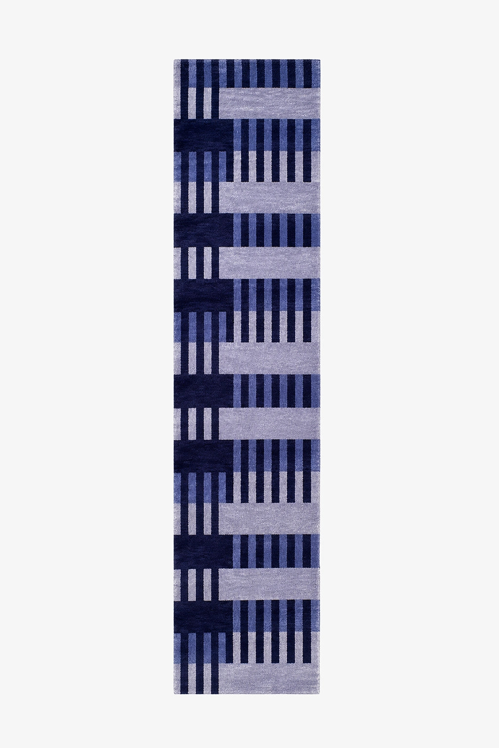 A long, narrow runner rug with a geometric pattern of vertical stripes in navy, medium blue, and light lavender-gray on a white background.