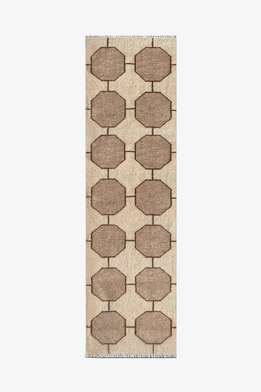 cream runner rug with geometric pattern on a plain background
