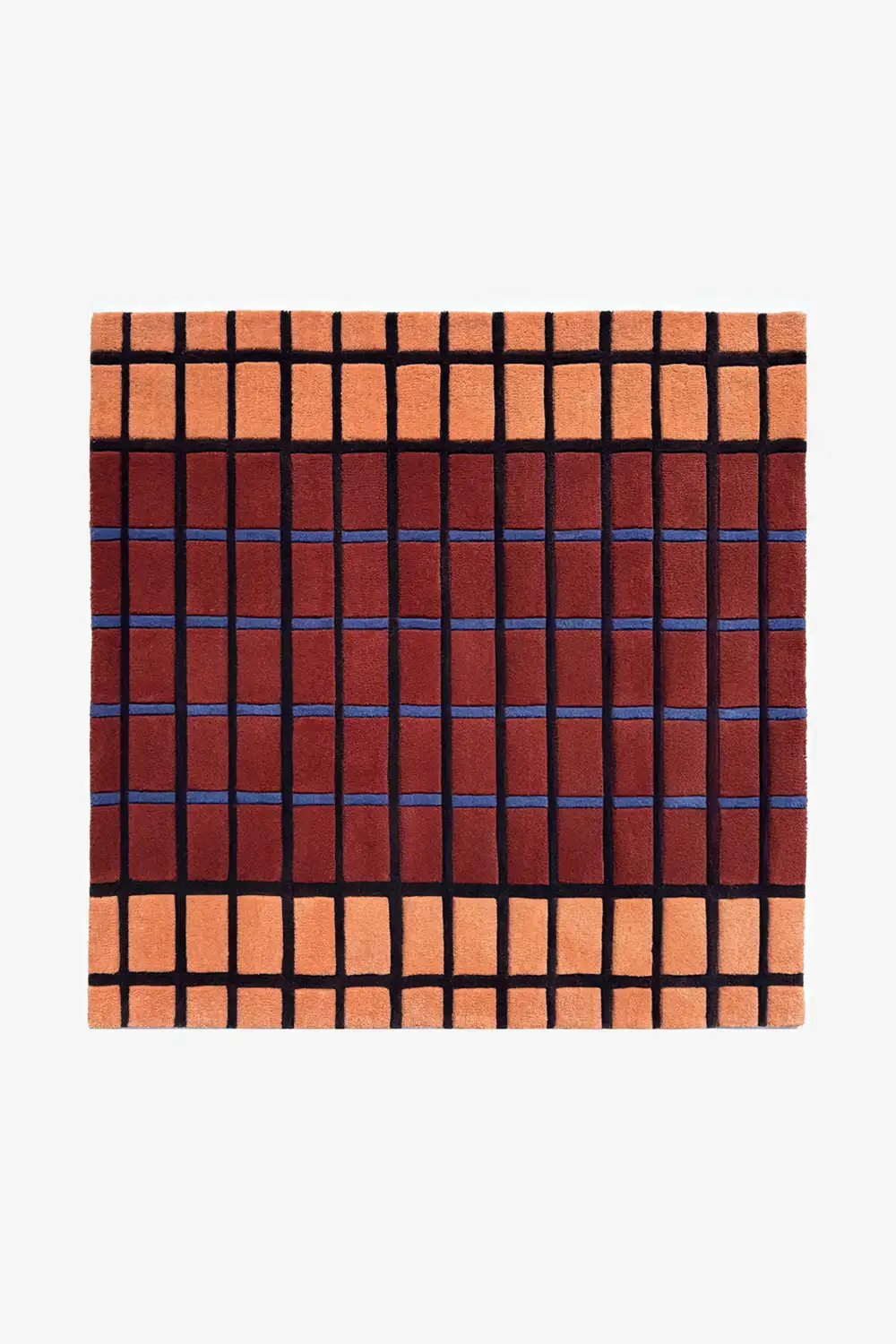 rust square wool rug with terracotta, blue, and black geometric grid mid century inspired