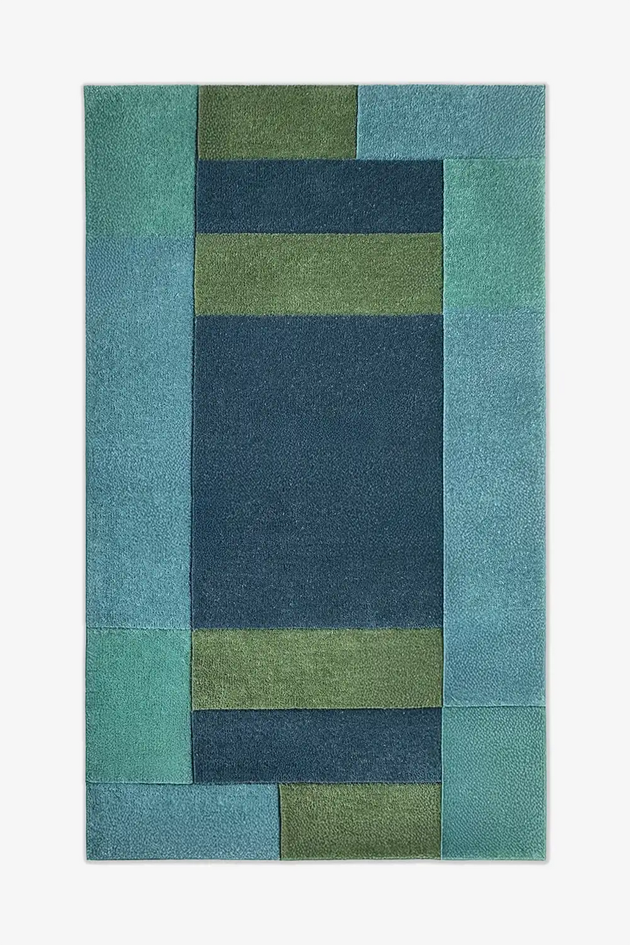 Modern 9x12 geometric area rug with bold blue and green color blocks, perfect for coastal or mid century living rooms